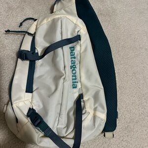 Patagonia White and emerald sling bag